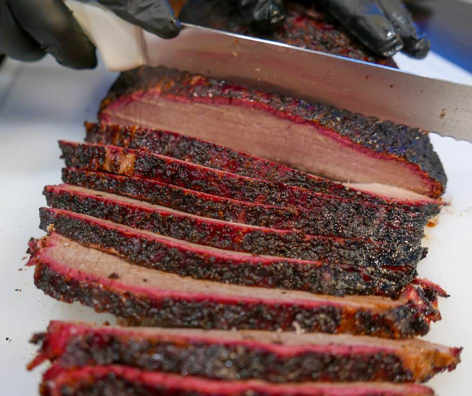 Sliced smoked brisket fresh off the smoker